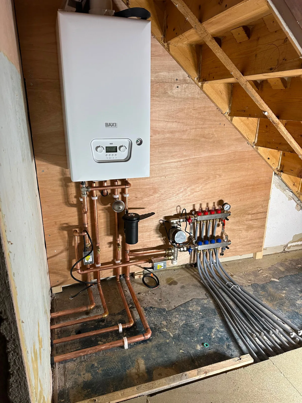 Underfloor heating manifold with multiple zones and pumps connected to a Baxi combi boiler in Blackpool