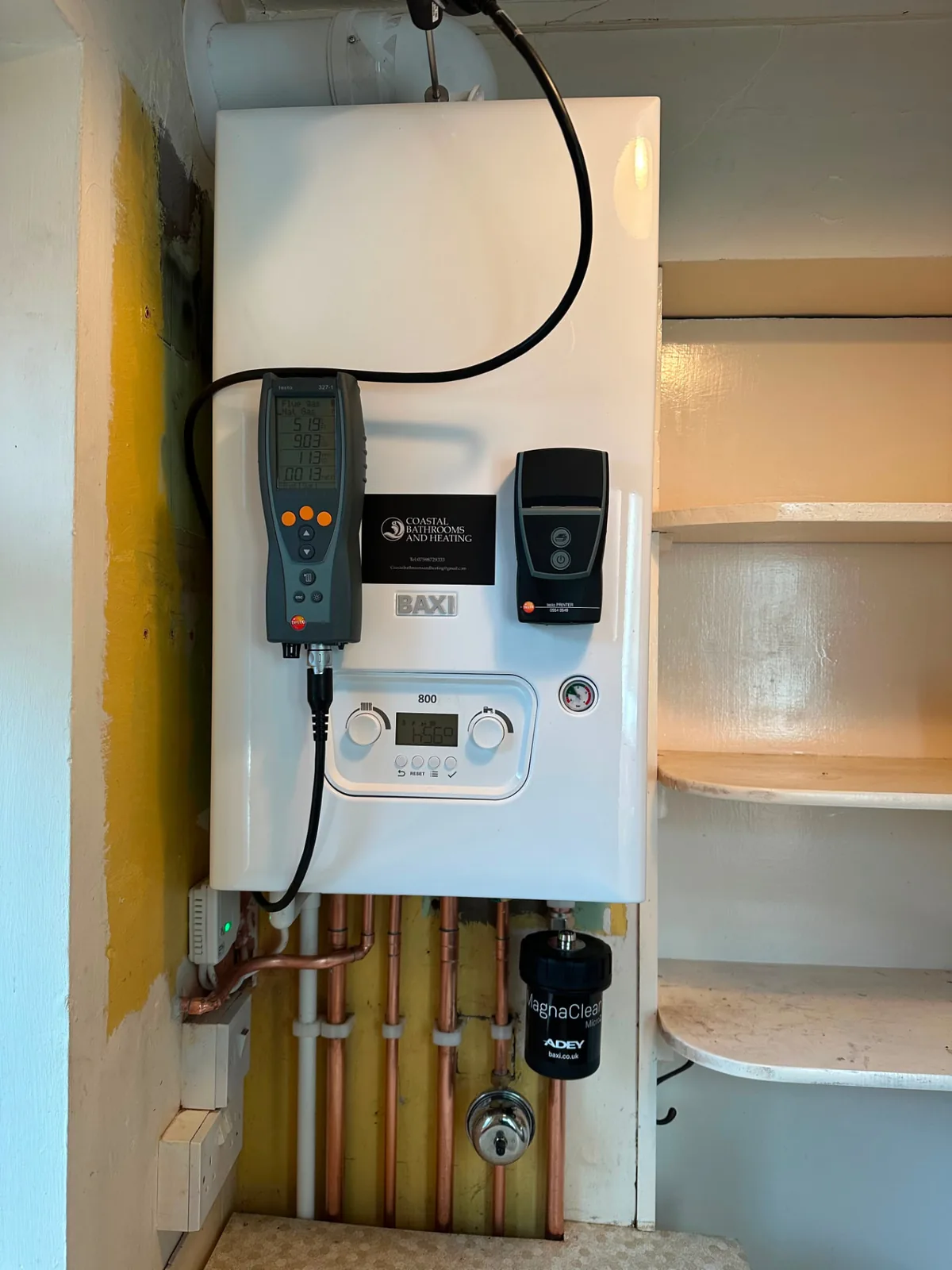 Baxi 800 boiler service in progress with flue gas testing equipment connected in a Fylde Coast home
