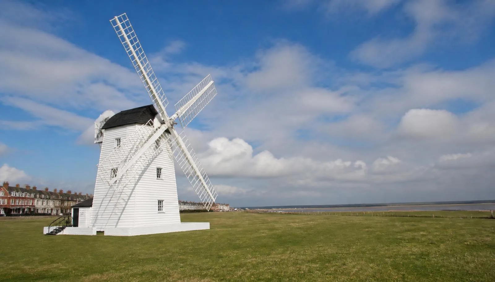 The white windmill on Lytham Green with the Ribble estuary beyond in Lytham St Anne's